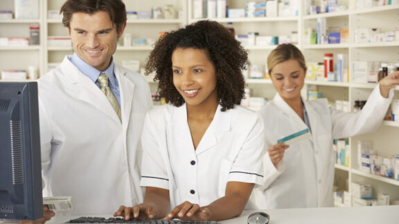 pharmacists working together. by Monkey Business Images. For case study for Bremo Pharmacy